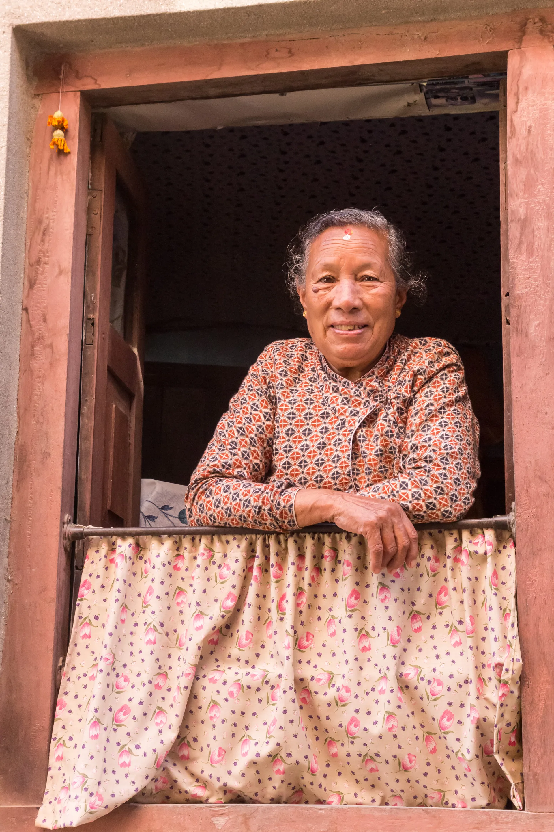 Priya sends money to her grandmother to assist with medical expenses
