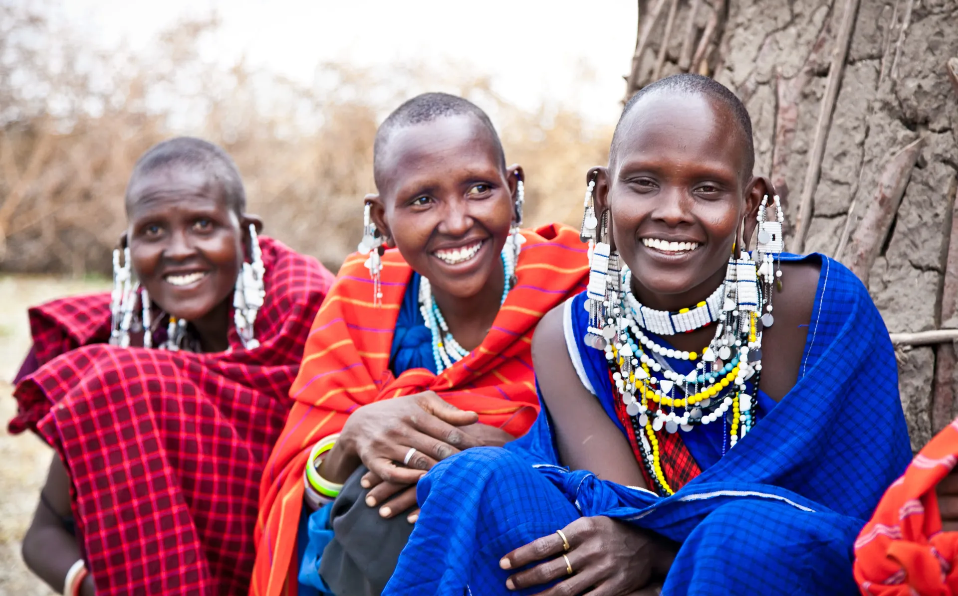 Imani, Amina and Anga can now afford better clothing with a money transfer sent by family living overseas